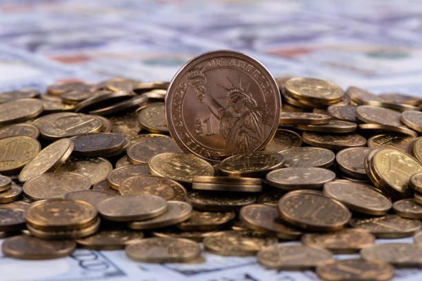 istock 1 dollar coin and 1 tenge coins 1312205249