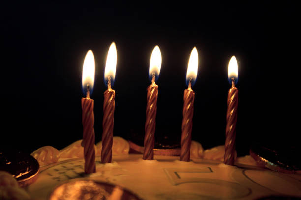 Moody; dim lighting; coin-themed cake;