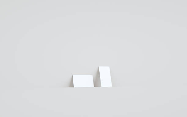 istock Business Card Mock-Up (3.5 x 2) Mock-Up - Two Cards Against Wall Background 1312212355