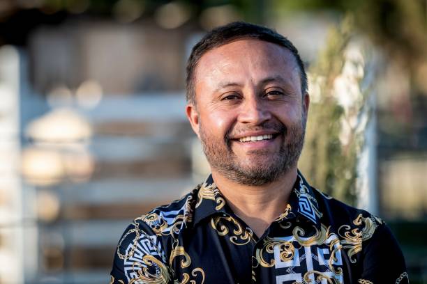 istock Smiling mature hispanic man looking at the camera 1312213073