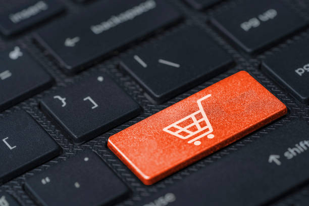 istock White Trolley or shopping cart icon print screen on Orange button computer keyboard , Shopping online concept. 1312215558