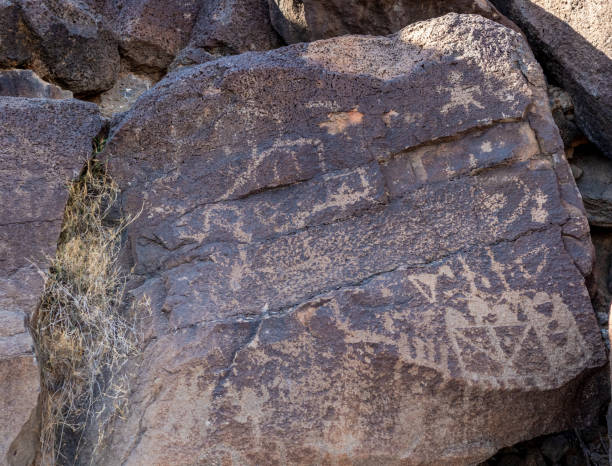 Ancient Native American Rock Art in Petroglyph National Monument Ancient Native American Rock Art in Petroglyph National Monument, Albuquerque, New Mexico albuquerque volcanoes stock pictures, royalty-free photos & images