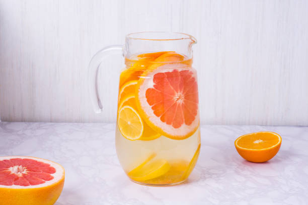 istock Lemonade. Drink with fresh oranges, lemons and grapefruit. Lemon cocktail with juice and ice. Citrus lemonade in glass jur. Refreshing summer drink 1312219401