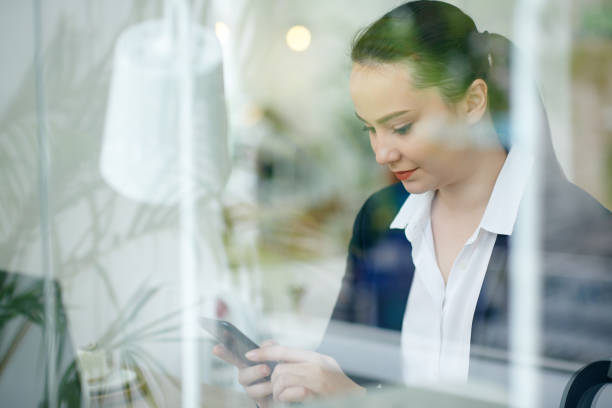 istock Businesswoman checking smartphone 1312220348