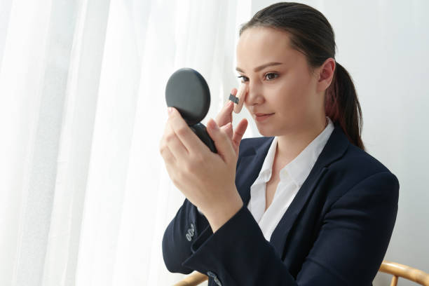 istock Young woman mattifying face 1312220389