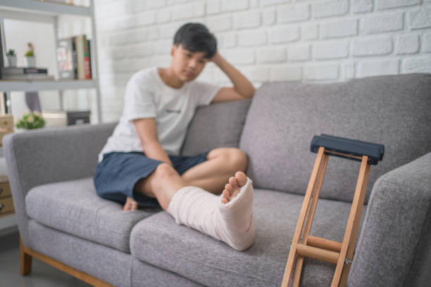 istock Asian people with broken leg recovering at home. 1312223874