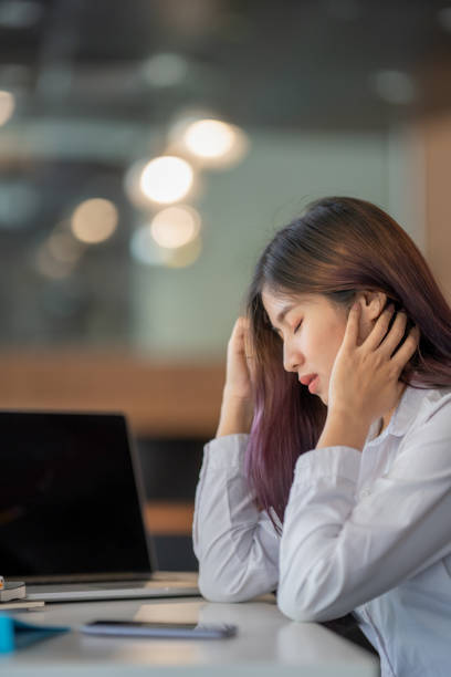 istock Asian businesswoman gets stressed while having a problem at work in the office. 1312224086