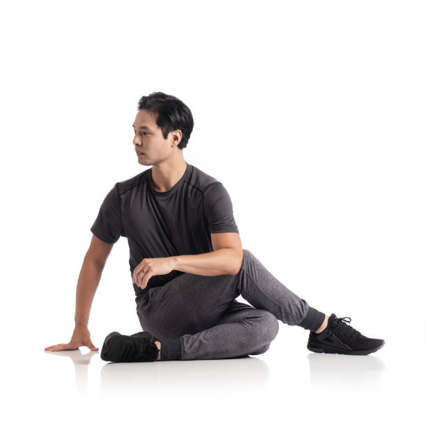 istock Japanese guy stretching on white background 1312225832