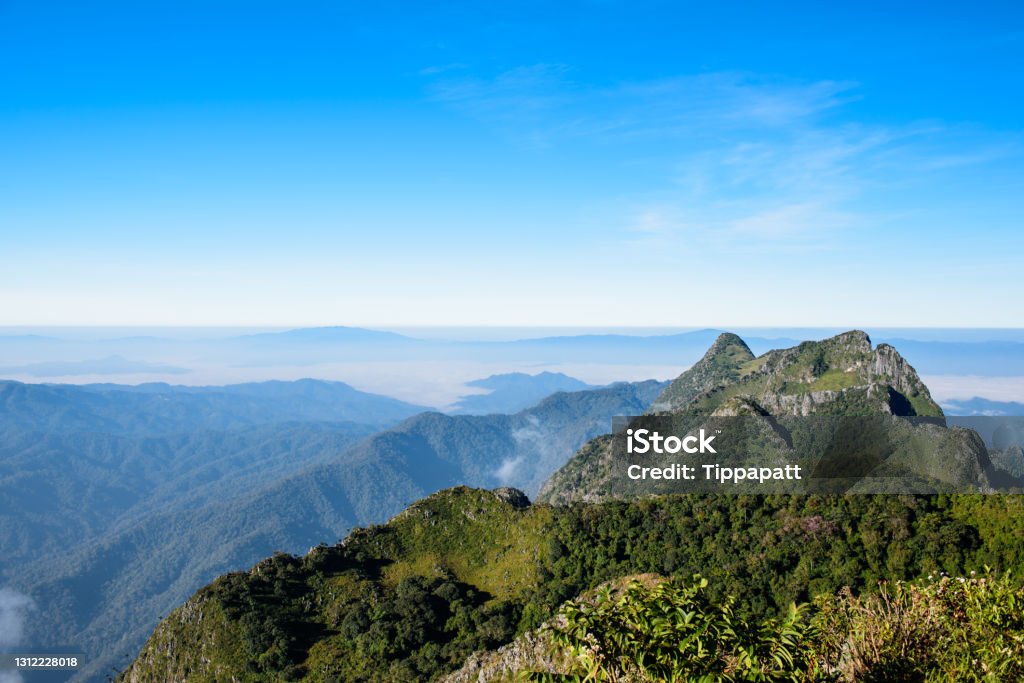 Mountain landscape Scenery fog and cloud mountain forest and sunrise sky, highland landscape with blue sky background on Doi Luang Chiang Dao, Chiangmai   Thailand Mountain Peak Stock Photo