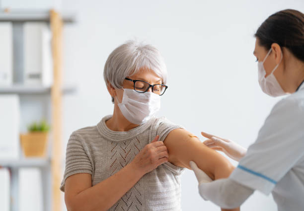 istock Senior woman after vaccination. 1312228919