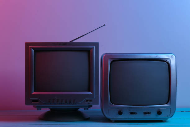 istock Two Old tv receiver in red blue neon light. Retro wave, media 1312233668