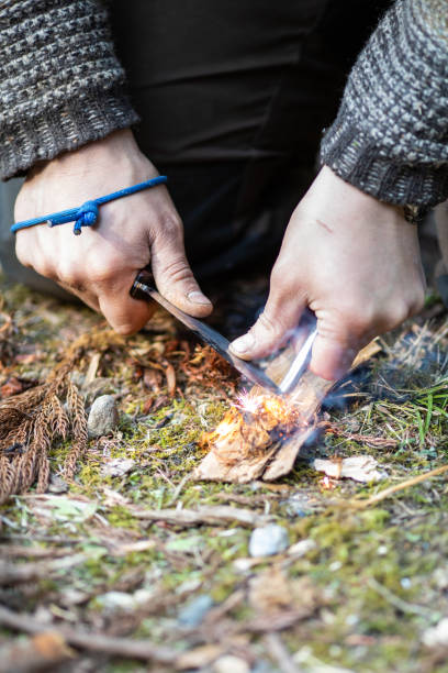 istock Primitive ways to start a fire with a Ferro cerium rod 1312234374