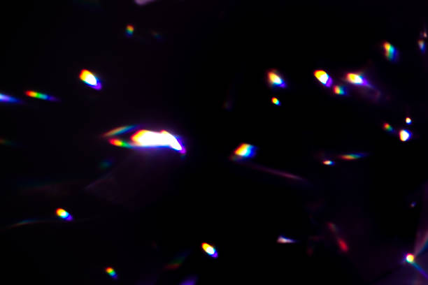 istock colorful warm rainbow crystal light leaks on black background 1312234394