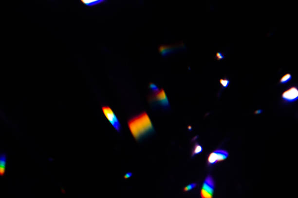 istock colorful warm rainbow crystal light leaks on black background 1312234474