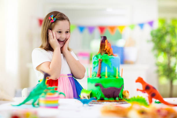 istock Kids birthday party. Dinosaur theme cake. 1312234603