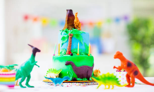 istock Kids birthday party. Dinosaur theme cake. 1312234727