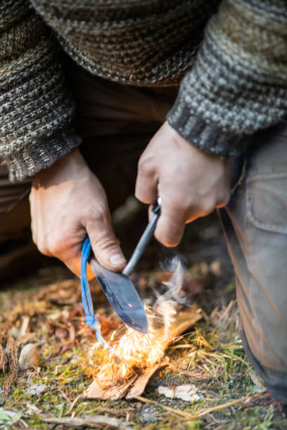 istock Primitive ways to start a fire with a Ferro cerium rod 1312234821