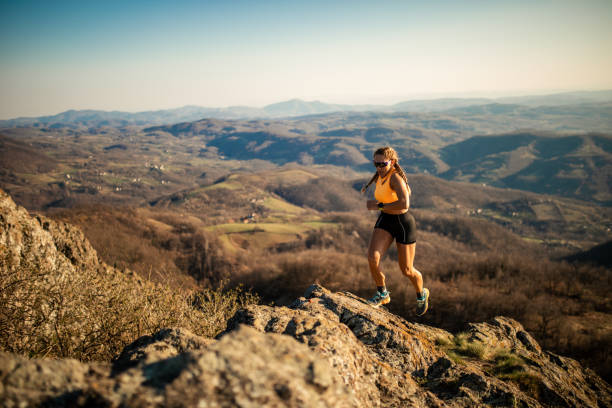 istock Woman running on mountain 1312239443