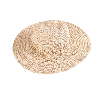 Beige artificial straw sun hat with straw ribbon, white background, clipping path