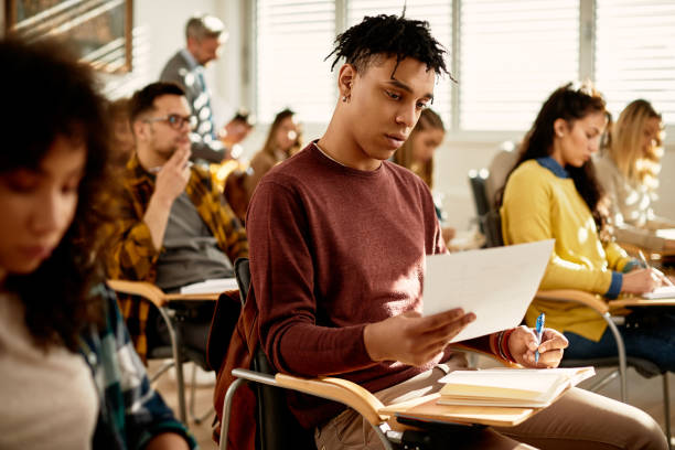istock African American college student learning during class in the classroom. 1312241500