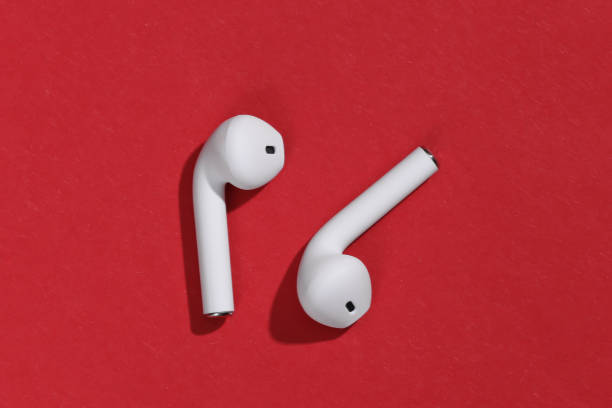 istock White true wireless bluetooth headphones or earbuds on bright red background 1312241621