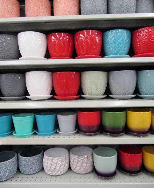 istock Colorful ceramic flower pots on shelves. 1312242562