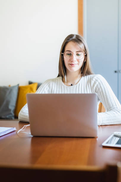 istock Young woman working at home with laptop 1312242771