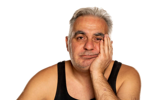 istock bored unshaven middle aged man 1312242817