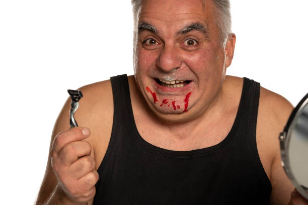 istock funny middle aged man with blood on his face 1312242872