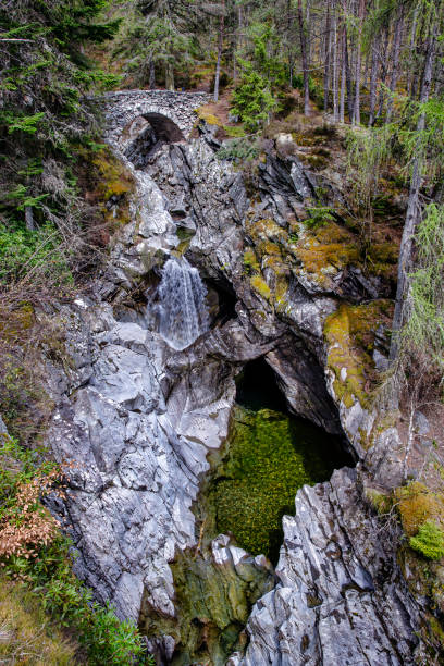 istock Falls of Bruar, small old bridge. 1312243919