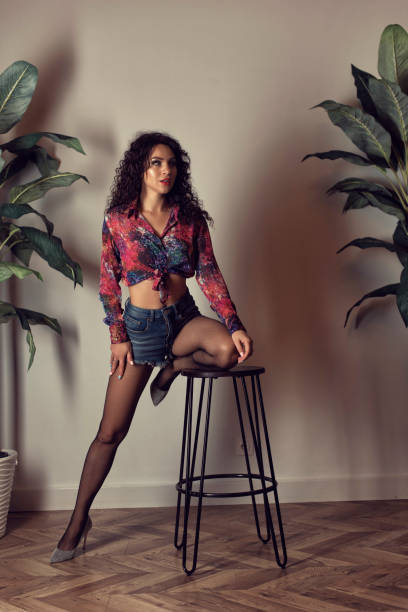 istock Young woman with curly hair in studio 1312244746