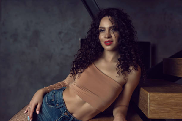 istock Young woman with curly hair in studio 1312244758