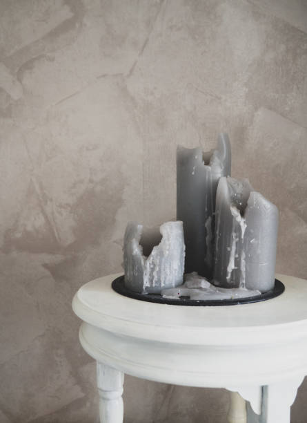 istock burnt large candles on a concrete background, a copy space 1312244813