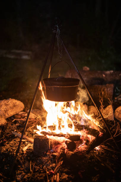 istock A Dutch oven cooking over a camp fire at night 1312245408
