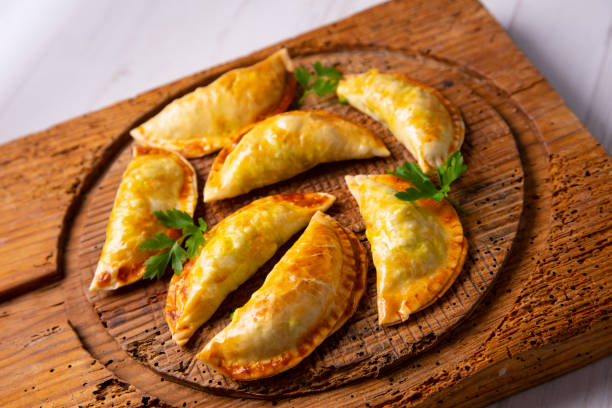 istock Argentinian empanadillas with minced meat and vegetables. 1312246378