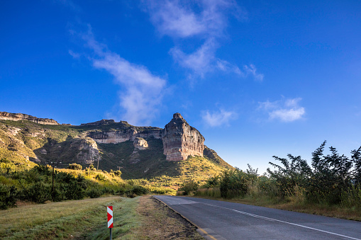 Sunrise travelling through the Golden Gate Highlands National Park, part of the Drakensberg mountain range in the Free State near Clarens, South Africa.