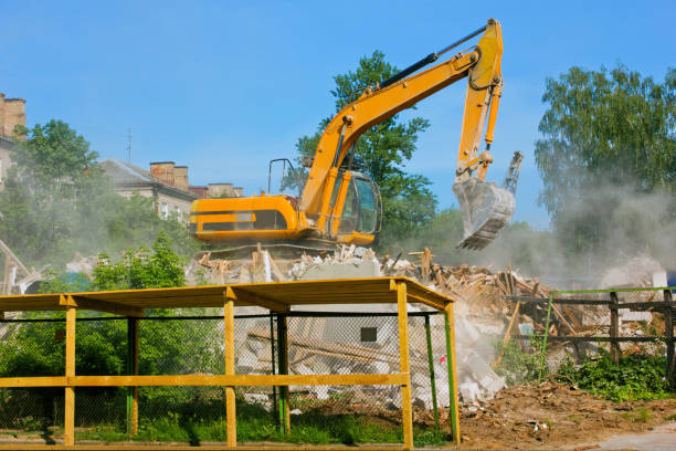 istock An excavator destroys an old building on a summer day 1312248443