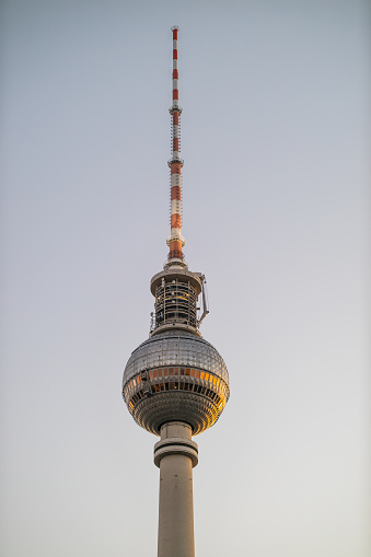 Vertical shot of the famous television tower in Alexanderplatz. Berlin, Germany. Image taken during sunset.