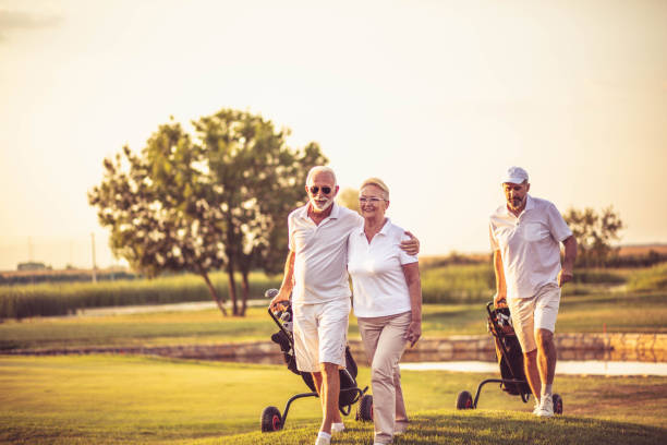 istock Three senior golfers. Focus is on man and woman. 1312248528