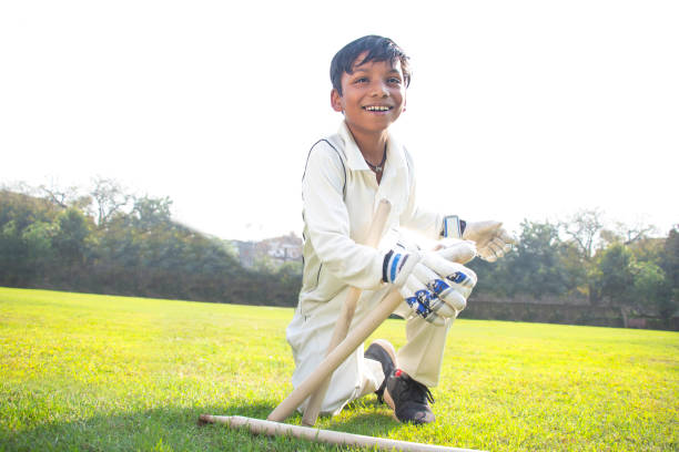 istock a boy wicket keeper stumping during cricket game 1312248815