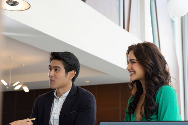 istock Customer go to hotel ‘s counter and talk to receptionist. 1312248910