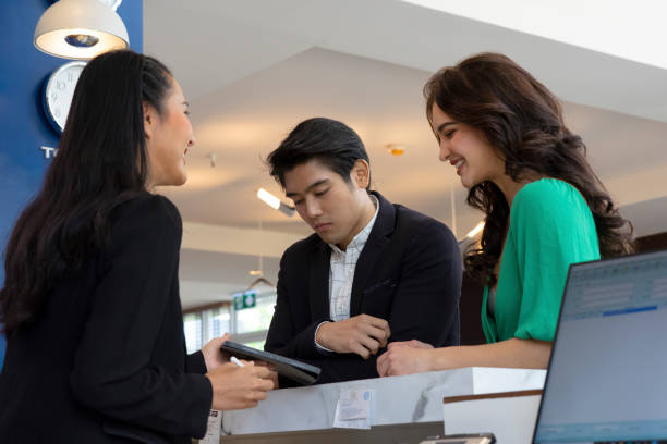 istock Customer go to hotel ‘s counter and talk to receptionist. 1312248923