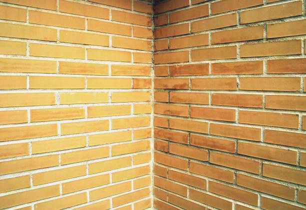 Orange and symmetrical background based on a brick wall.
