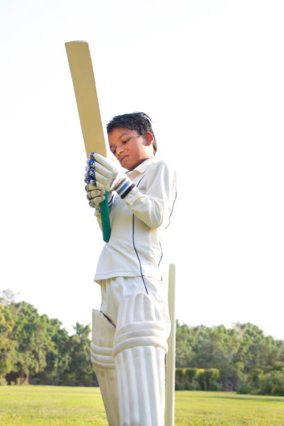 istock a boy Holding cricket bata during cricket game 1312249062