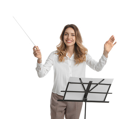 Music teacher with baton and note stand on white background