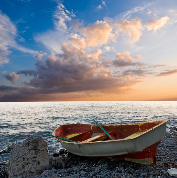 istock oared boat on a sea coast 1312249801