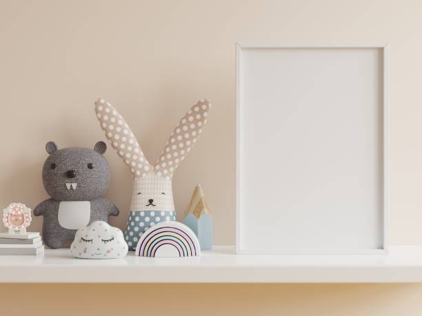 istock Mock up posters in child room interior, posters on empty cream color wall background. 1312249947