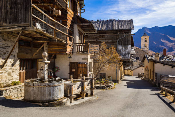 Saint-Veran and its wooden houses, fountain and church. One of the three highest villages in Europe. Queyras Regional Natural Park, French Alps. Hautes-Alpes, France Saint-Vérant, Hautes-Alpes, FRANCE - November 11, 2019: The main street in Saint-Veran and its wooden houses, fountain and church. One of the three highest villages in Europe. Queyras Regional Natural Park, French Alps hautes alpes photos stock pictures, royalty-free photos & images