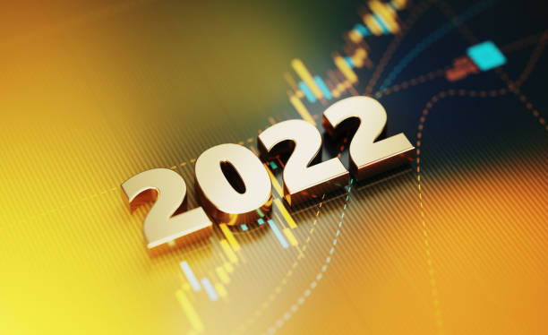 concetto di investimento e finanza - 2022 seduta su sfondo grafico finanziario giallo - stock exchange stock market data finance financial figures foto e immagini stock