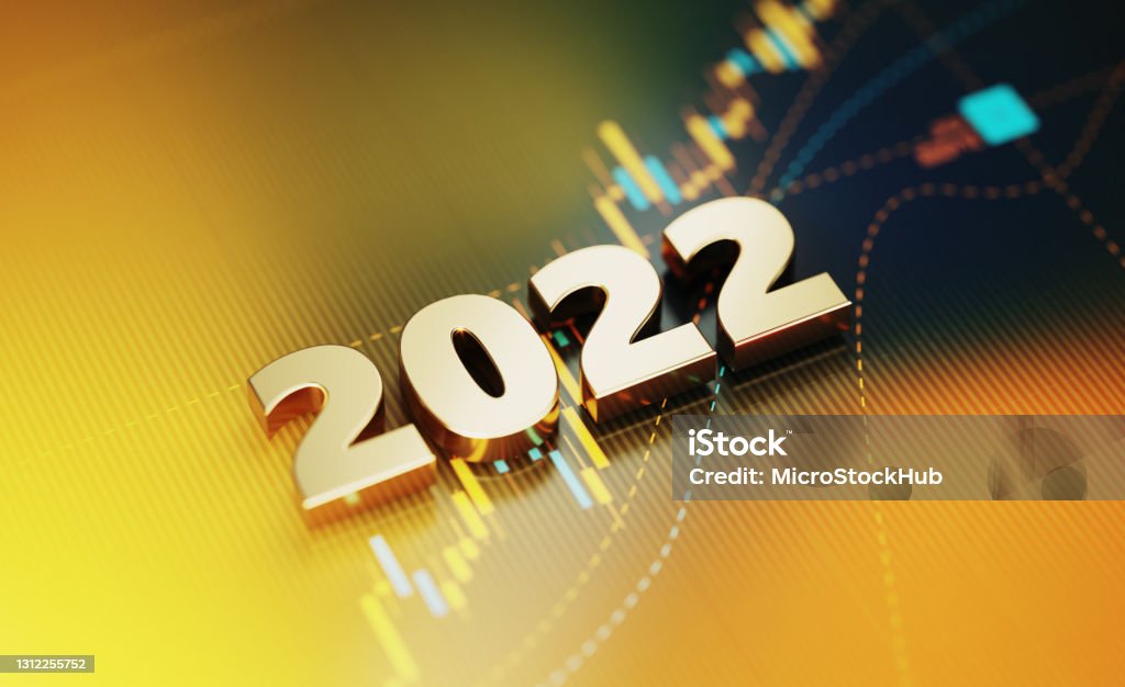 Investment And Finance Concept - 2022 Sitting On Yellow Financial Graph Background Gold colored 2022 sitting on yellow financial graph background. Horizontal composition with selective focus and copy space. Investment, stock market data and finance concept. 2022 Stock Photo